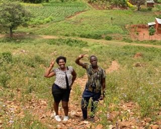 Guests on a guided village walk, exploring the local area near Jinja.